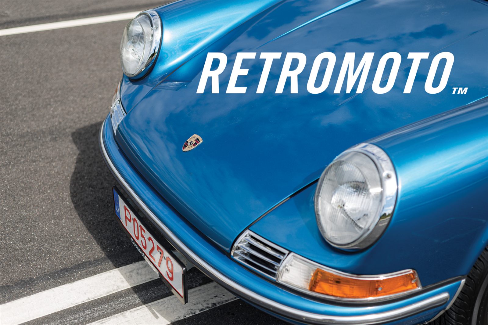 Blue air-cooled Porsche 911 with the Retromoto wordmark